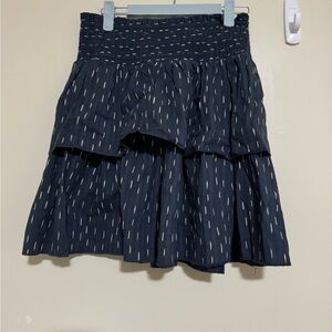 Navy blue with gold matalic lines. Mini skirt.